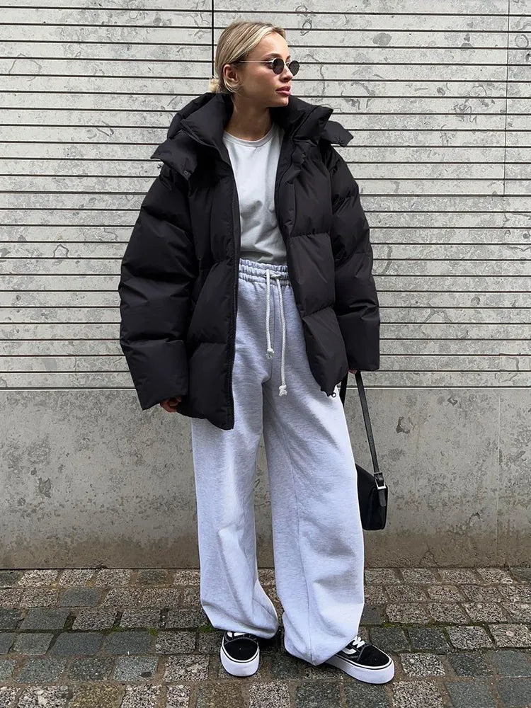 Damen lange Steppjacke mit Kapuze und Seitentaschen, Größen S–L