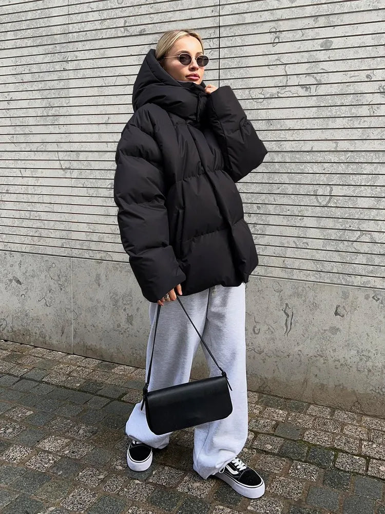 Damen lange Steppjacke mit Kapuze und Seitentaschen, Größen S–L