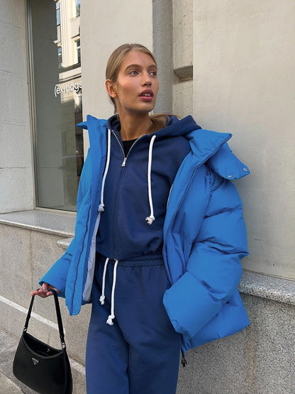 Damen lange Steppjacke mit Kapuze und Seitentaschen, Größen S–L
